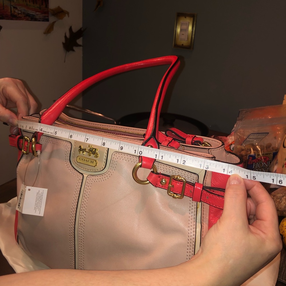 NWT Coach multicolored coral medium hand bag.